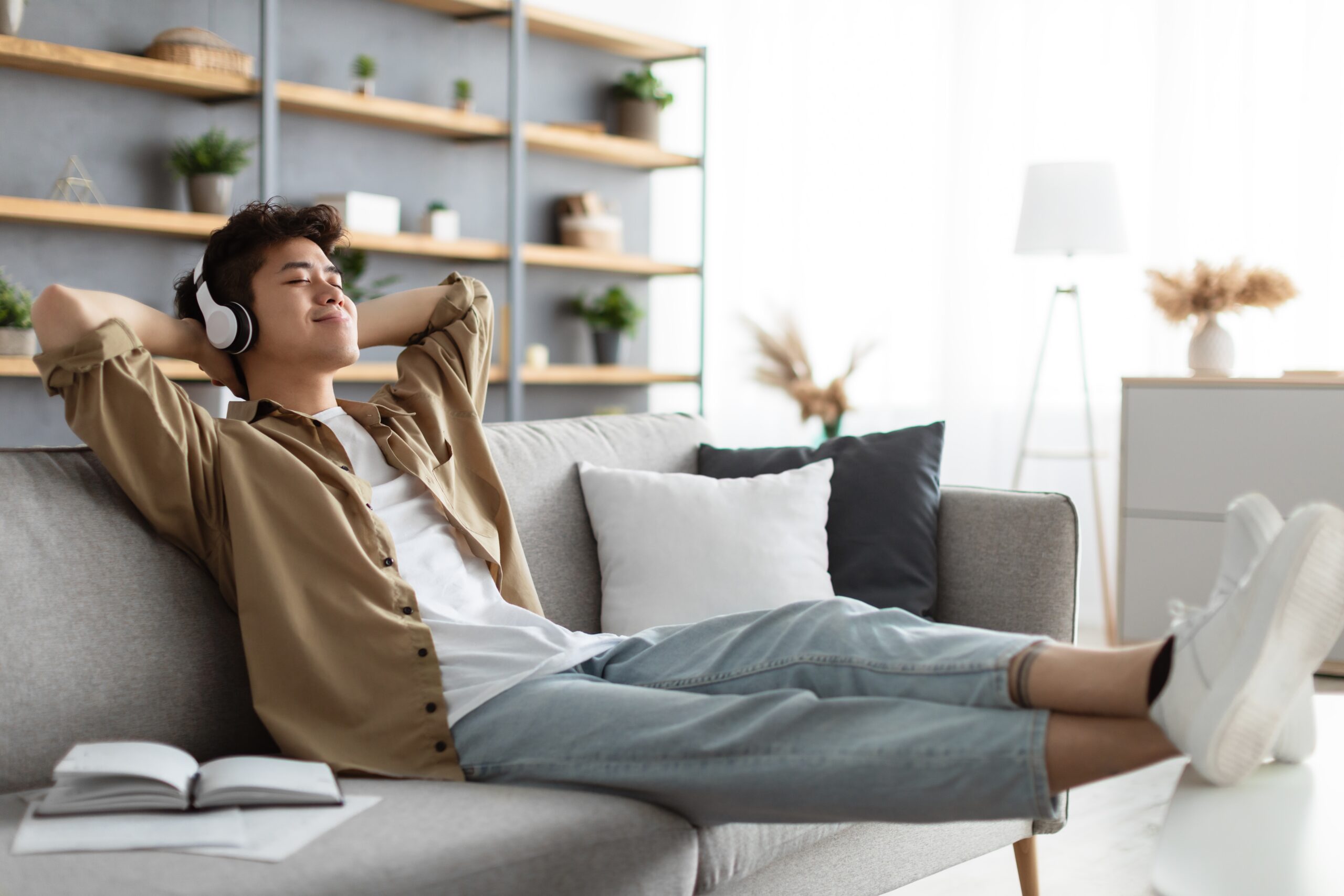 Rest,And,Relax,Concept.,Calm,Asian,Man,Sitting,On,Couch,